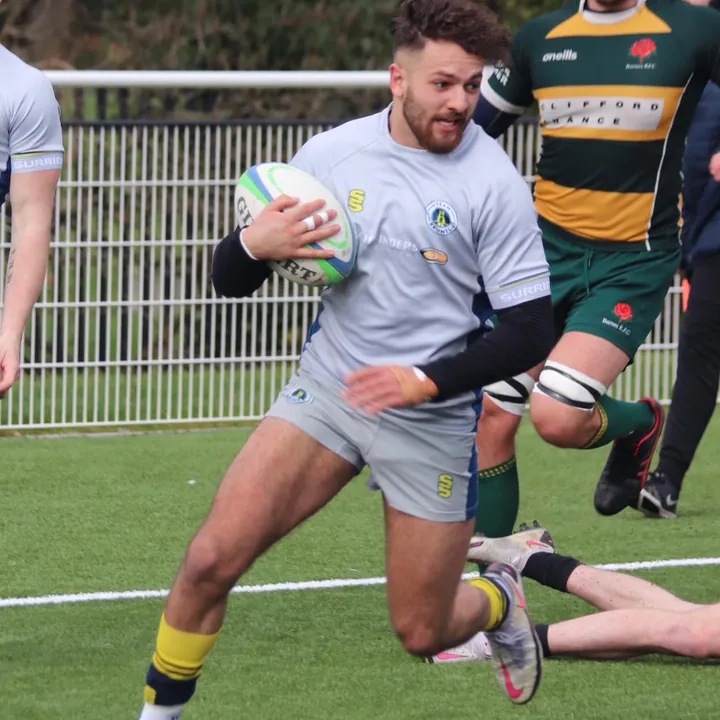 Anwar carrying the ball in a rugby match